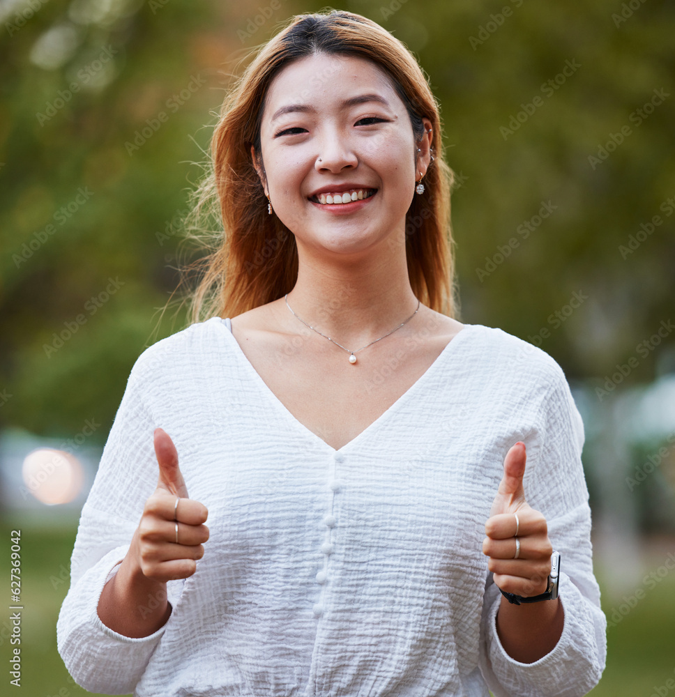 Thumbs up, happy and portrait of Asian woman in park for support, relaxing and happiness outdoors. S