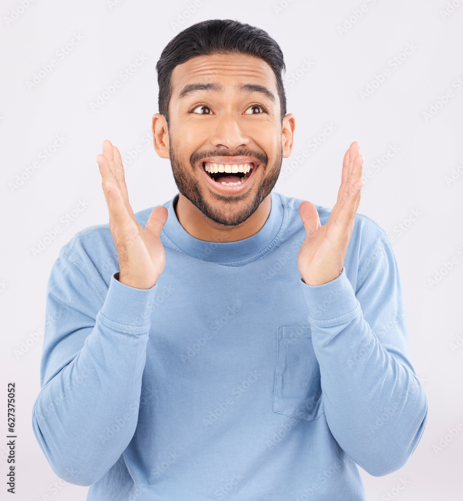 Wow, smile and happy asian man in studio for celebration, news or sale promo on grey background. Fac