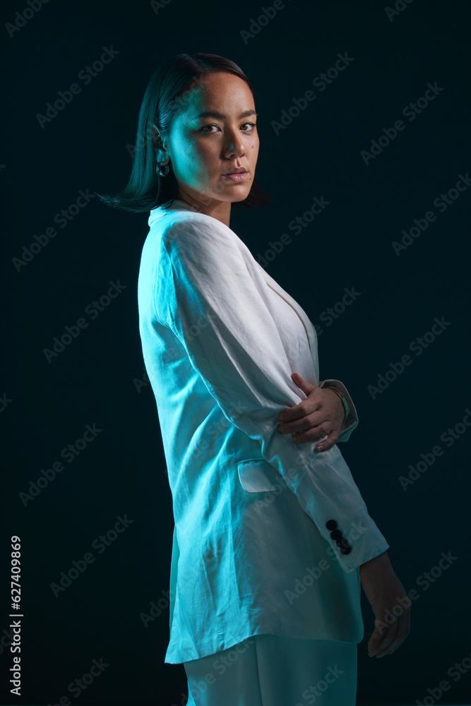 Professional, portrait and woman in suit on a dark background for a corporate aesthetic. Serious, fa