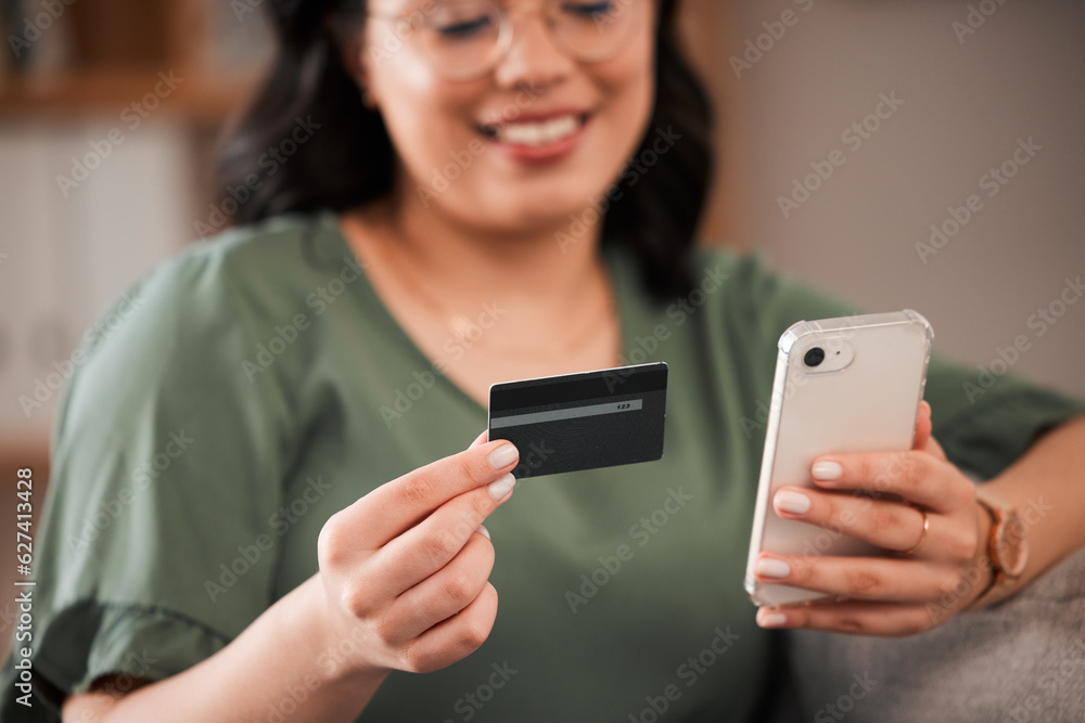 Smile, woman and a credit card and phone for online shopping, banking app or ecommerce on the sofa. 