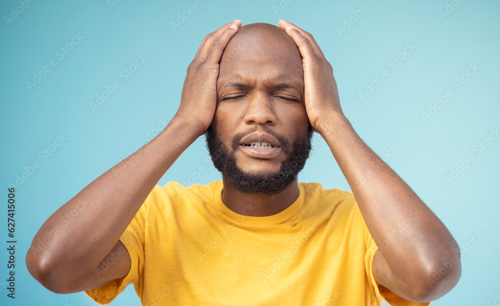 Fail, mistake and mental health with a black man in studio on a blue background feeling stress or an