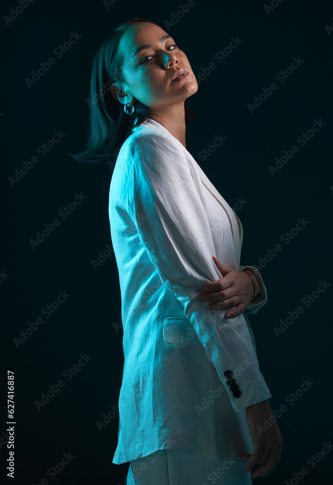 Fashion, portrait and a woman in a suit on a dark background for a corporate aesthetic. Serious, sty