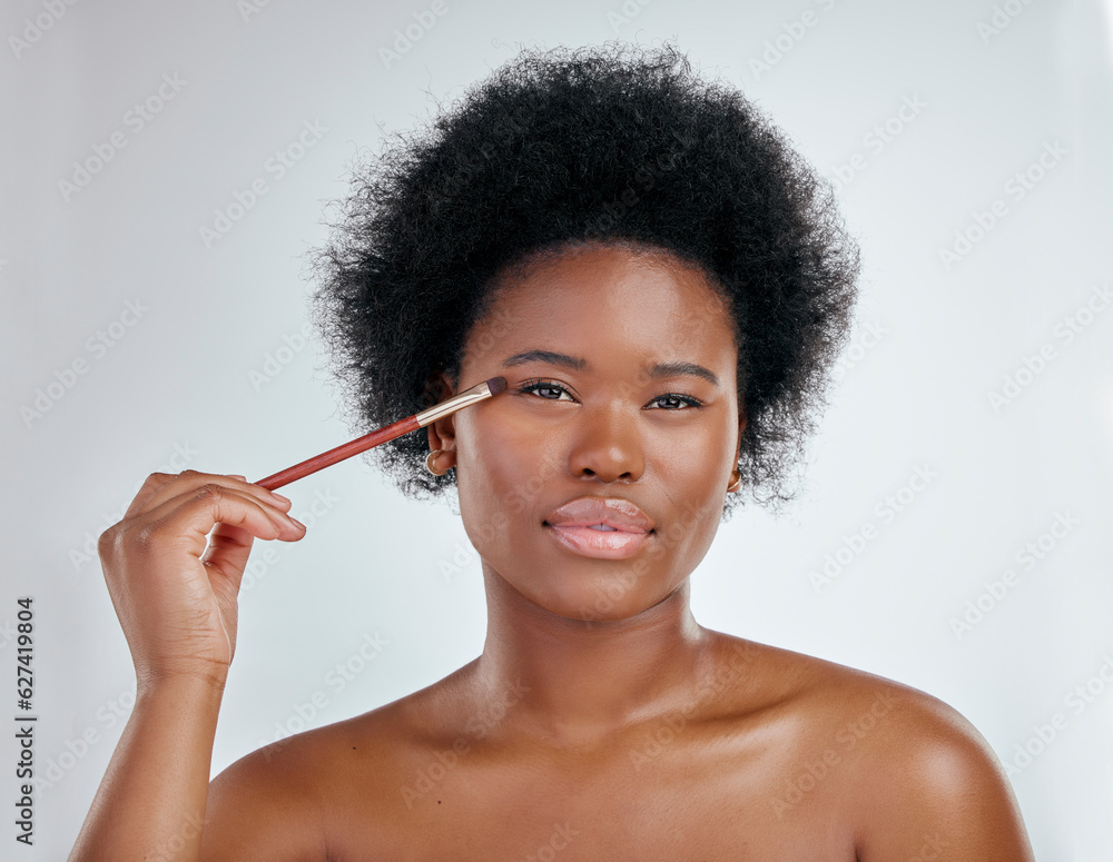 Black woman, portrait and makeup brush on eyes for skincare beauty against a white studio background