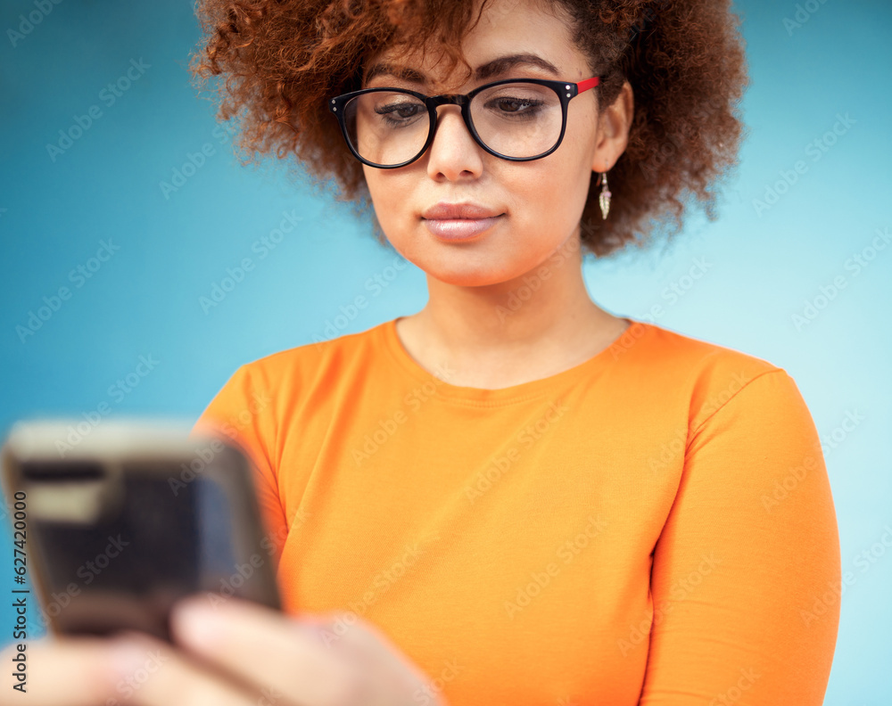 Woman, cellphone and mobile texting on blue background for social media, technology and network. You