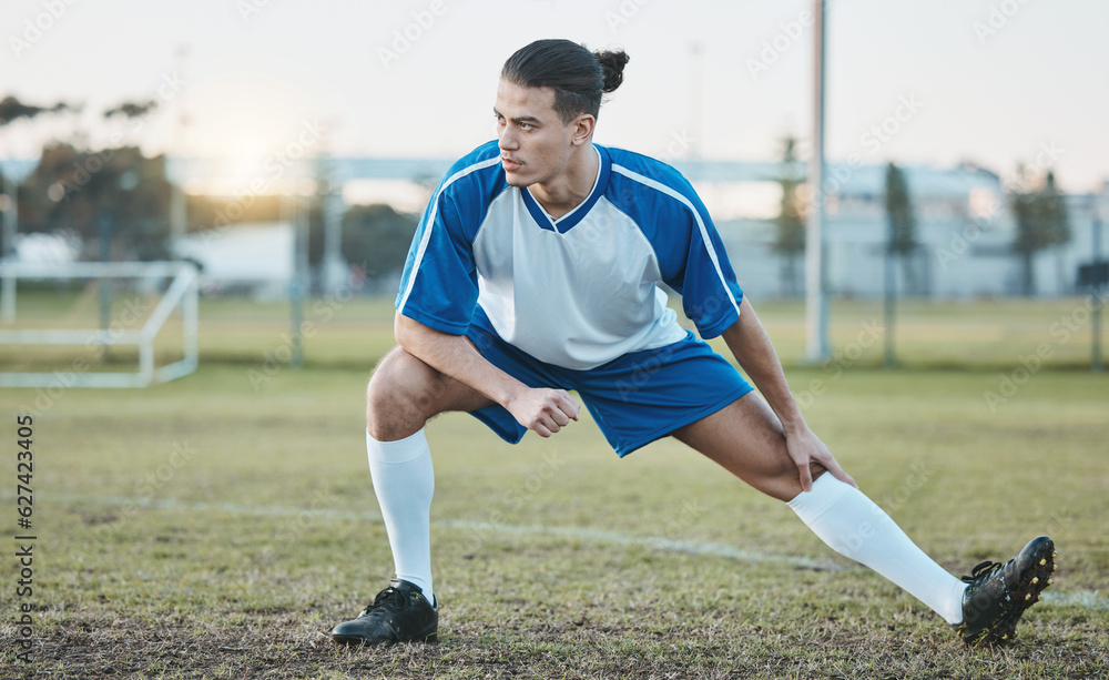 Thinking, sports or soccer player stretching legs on football field in training, exercise or workout