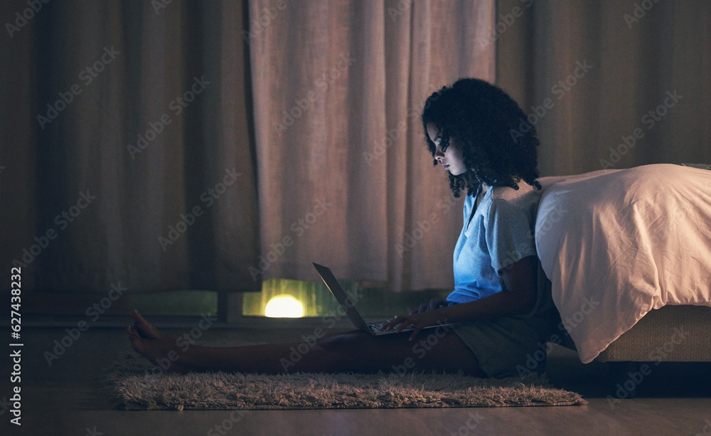 Laptop, night and woman in her bedroom networking on the internet, social media or website. Technolo