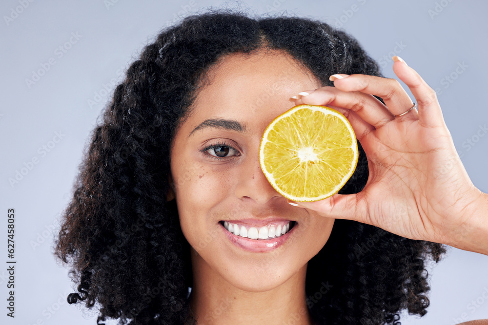 Skincare, smile and lemon eye for nutrition or fruit with glow in grey studio background. Female per