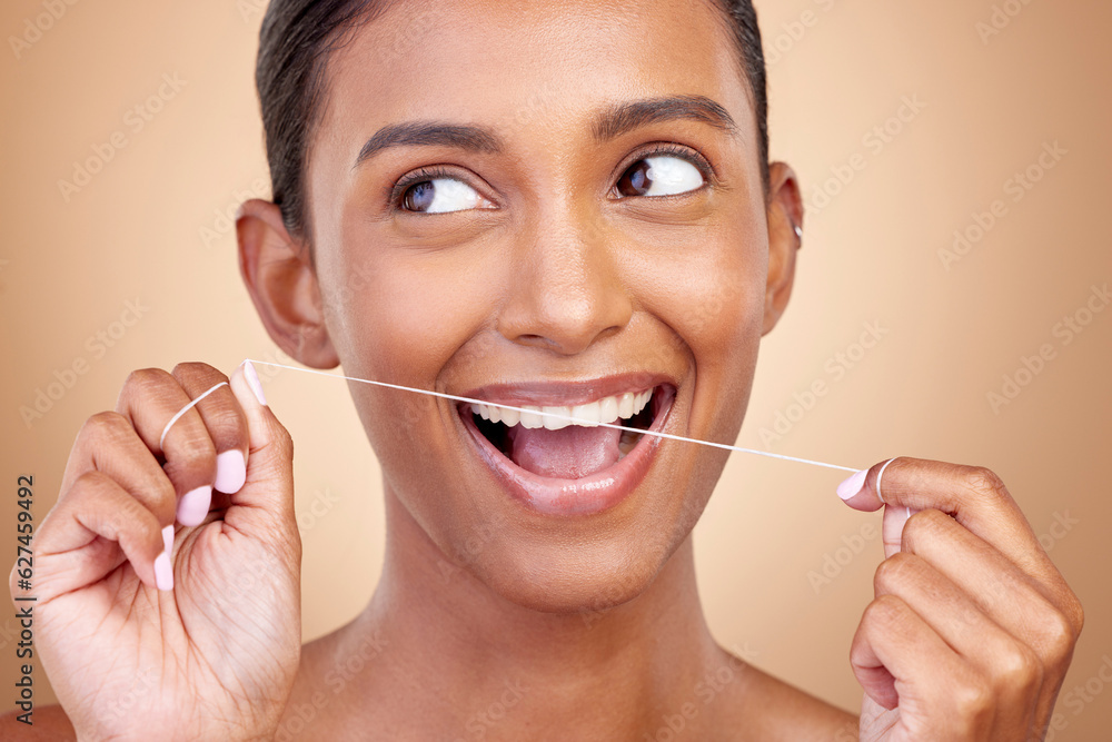 Woman, dental floss and studio for thinking, smile and cleaning for teeth whitening by brown backgro