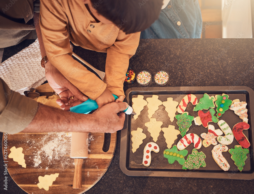 Christmas, above and a family baking cookies, help with food and process of decoration. Hands, child