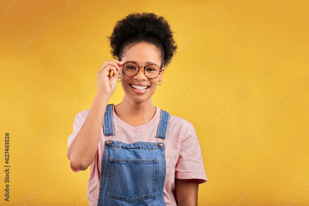 Portrait, glasses and smile with a black woman on a yellow background in studio for vision. Fashion,