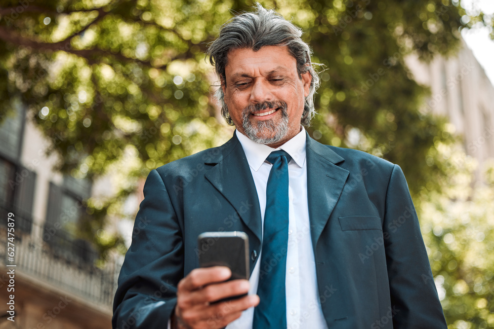 Senior businessman, phone and texting in street with smile, thinking and communication on internet. 