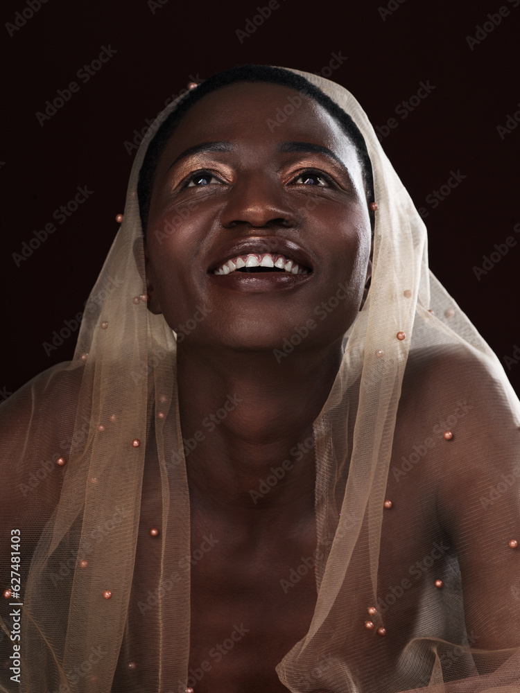 Things are looking up. Studio shot of an attractive young woman posing in traditional African attire