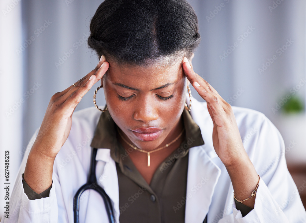 Tired doctor, black woman and stress with headache at clinic, office and thinking with pain at job. 