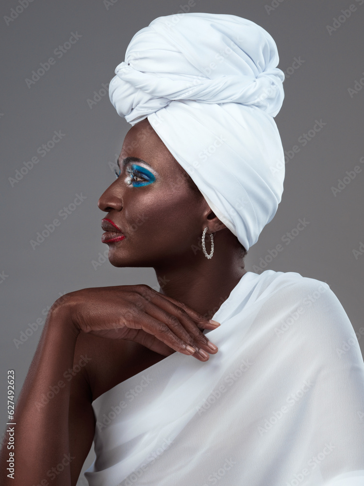 The simplest accessories speak the loudest. Studio shot of an attractive young woman posing in tradi