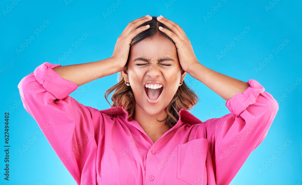 Angry, frustrated and a shouting woman on a blue background with a anger about mental health. Stress