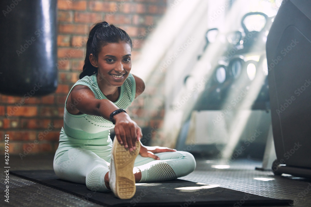 Gym, fitness or portrait of happy woman stretching legs for a workout or body movement for wellness.