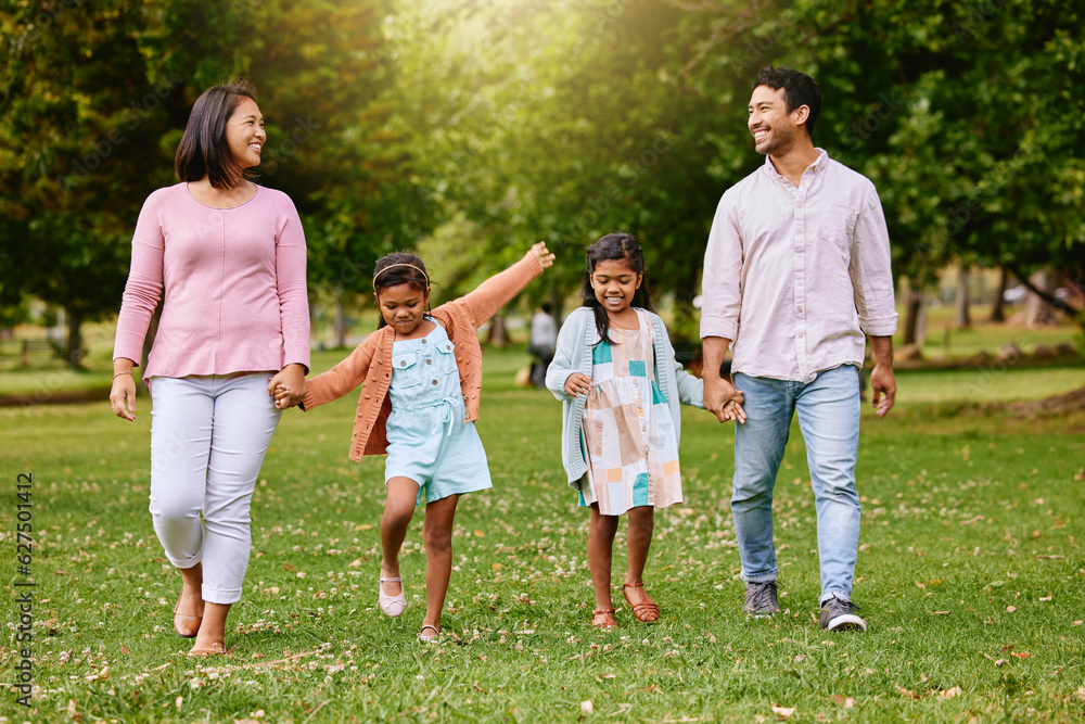 Park, walk and happy family holding hands, talking and bonding with love, smile and fun in nature. C