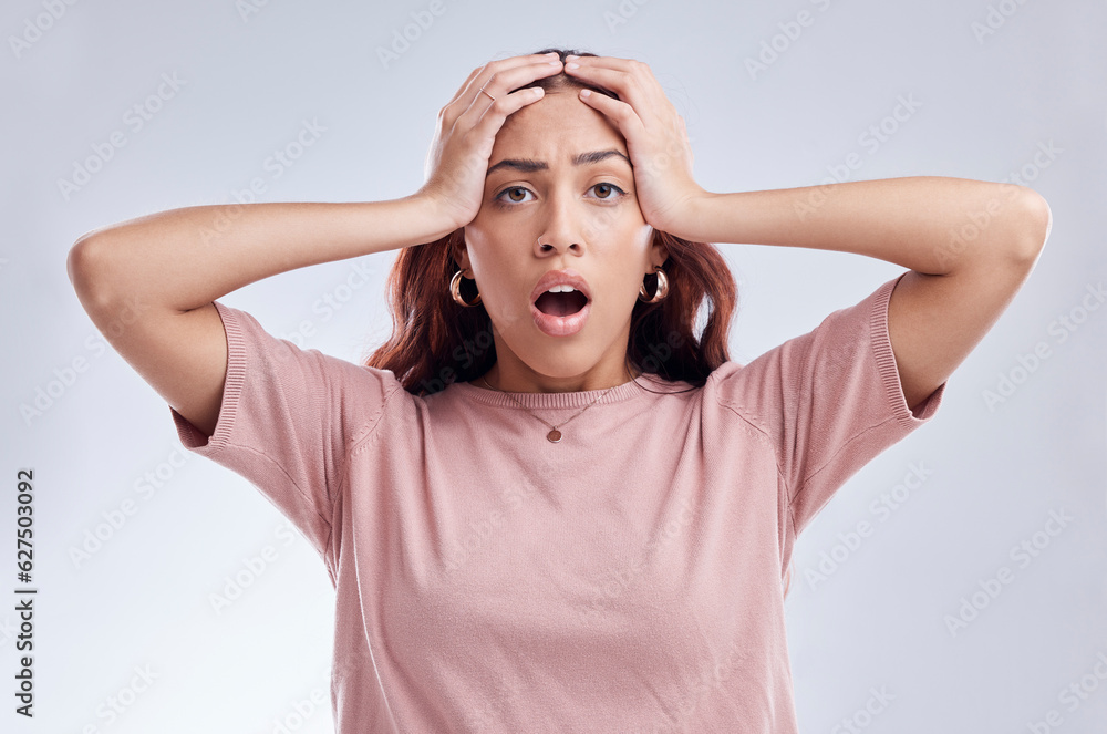 Mistake, wow and young woman in studio with hand on head for anxiety, stress or panic. Portrait of a