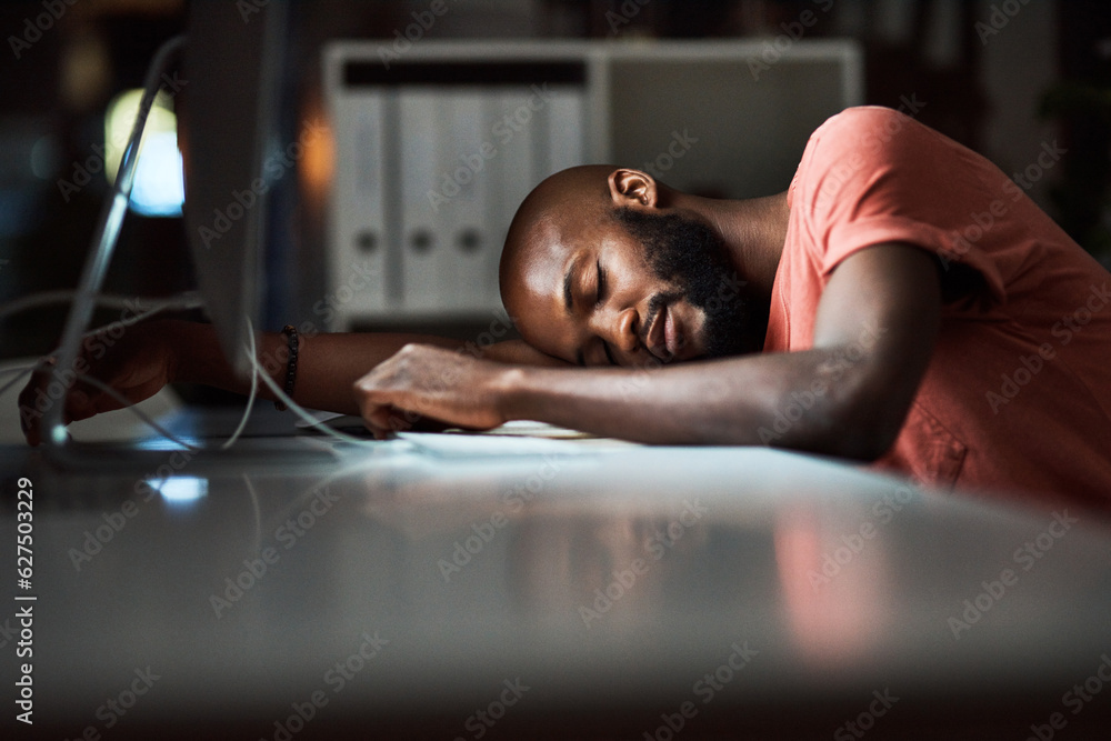 Hes had enough. Cropped shot of a man falling asleep while working late at the office.