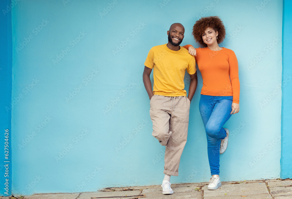 Interracial, portrait and couple on a city wall for travel, holiday and happy in Germany. Smile, rel