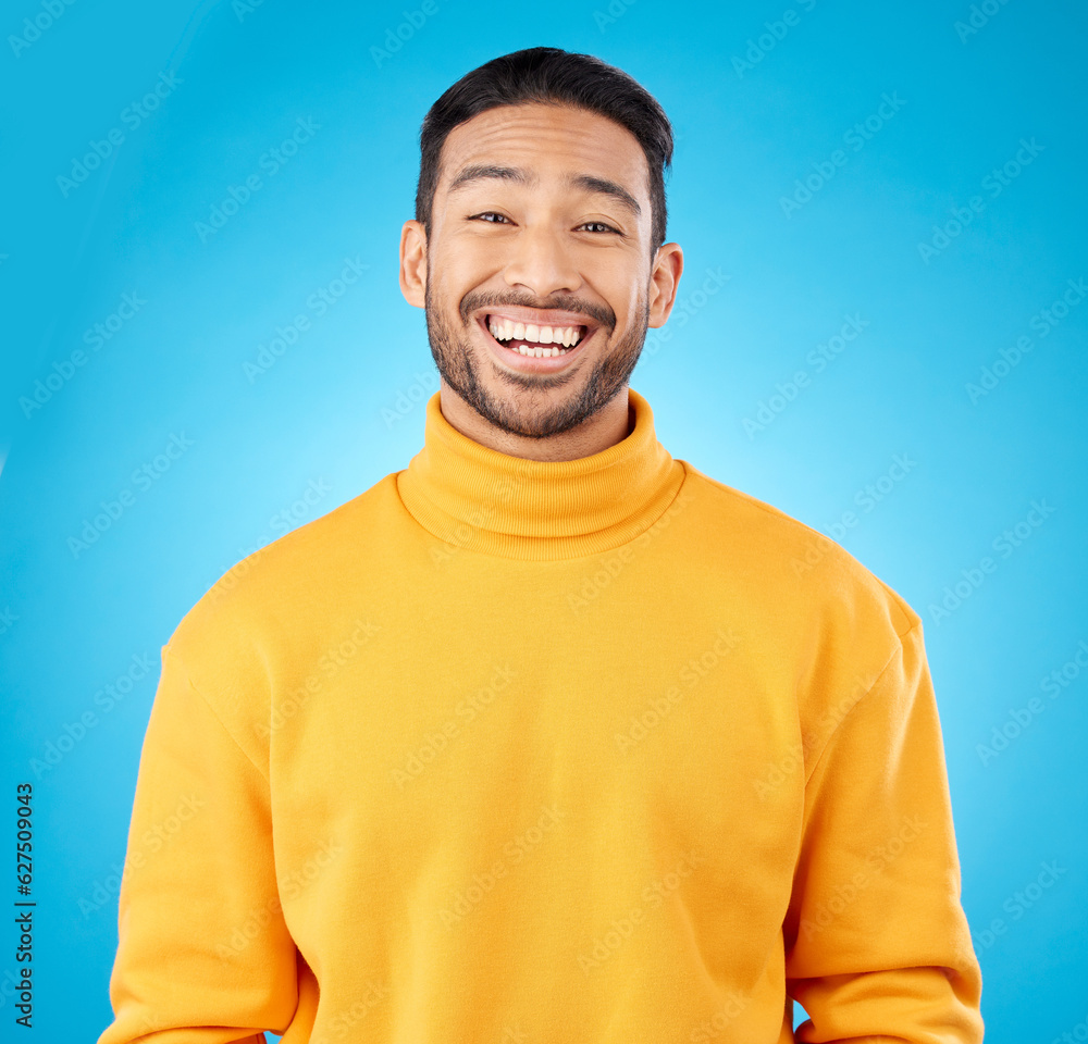 Laugh, portrait and happy asian man in studio with humor, joke or funny smile reaction on blue backg