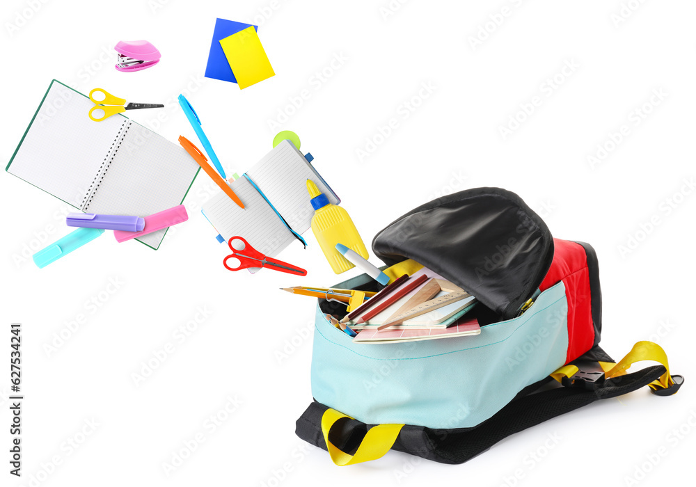 School backpack with flying stationery on white background