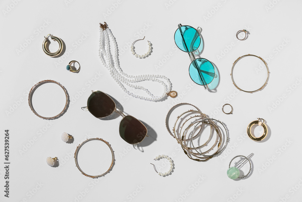 Jewelry with sunglasses on white background