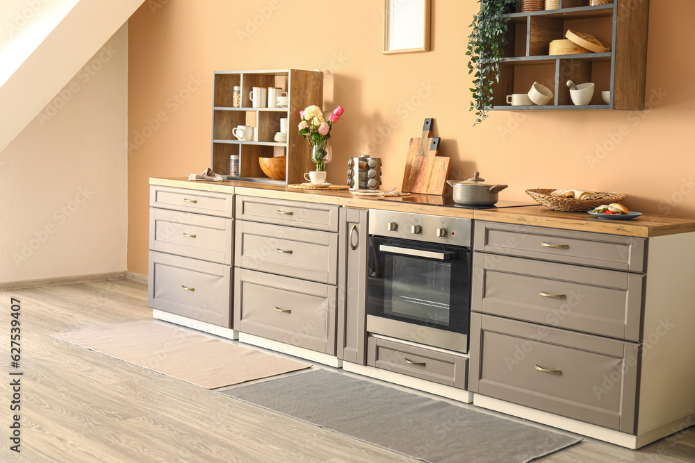 Interior of modern kitchen with stylish rug