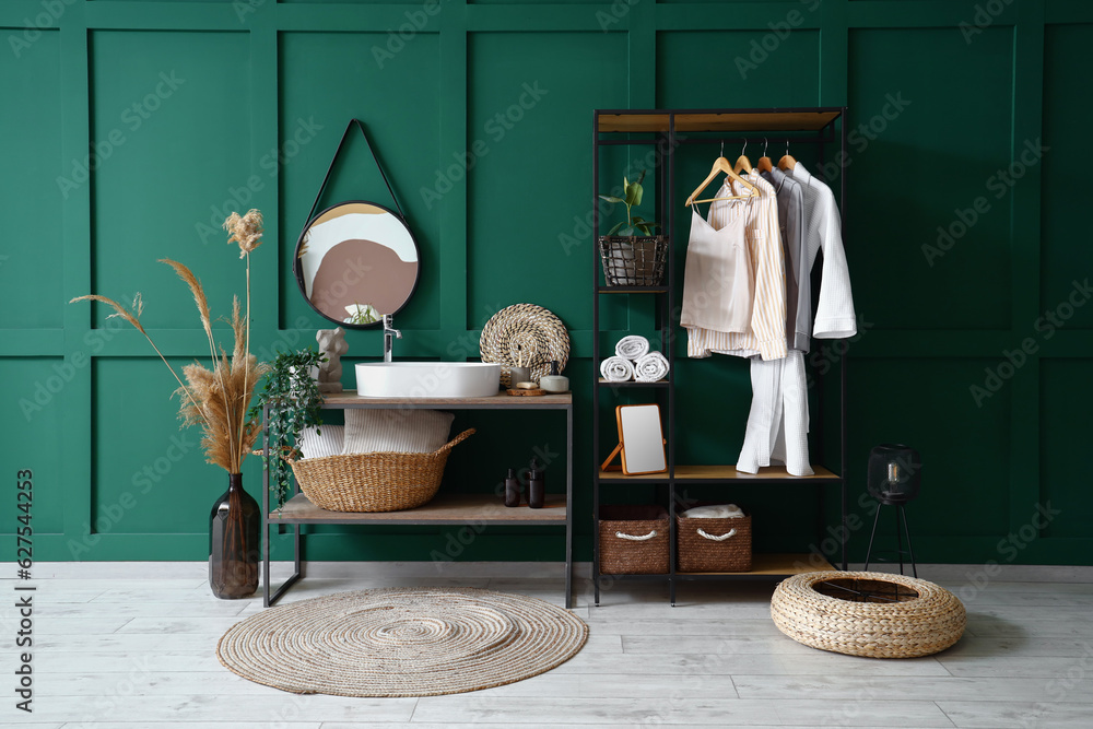 Interior of bathroom with sink and shelving unit