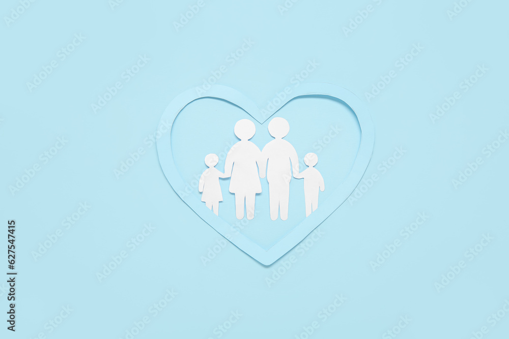 Figures of family with heart on blue background