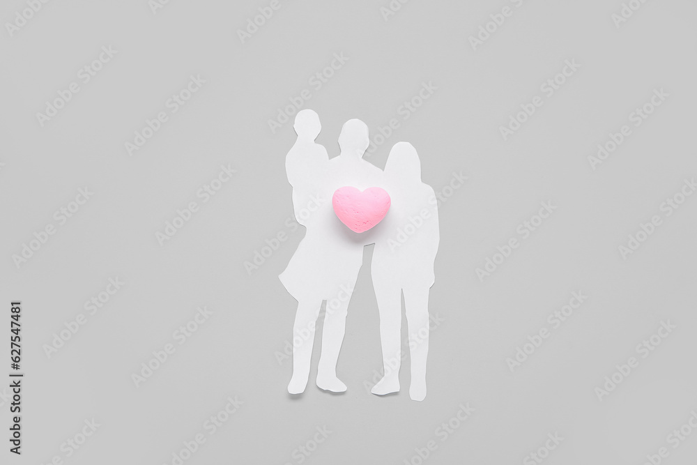 Figures of family with heart on grey background. Family love concept