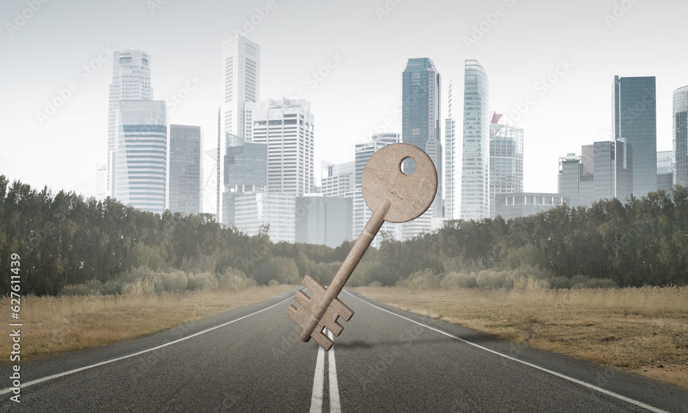 Conceptual background image of concrete key sign on asphalt road