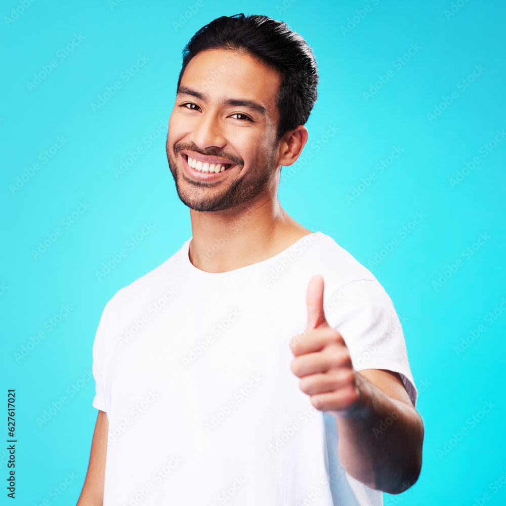 Smile, thumbs up and portrait of a man in a studio with a satisfaction sign or expression. Happy, em