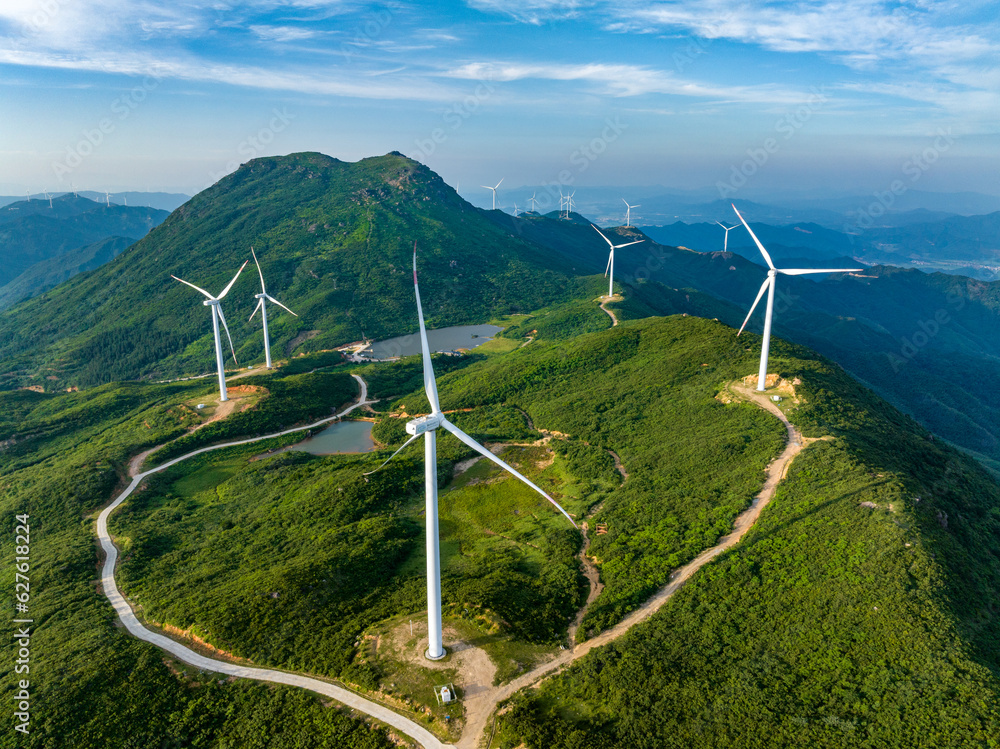 Wind farm on the mountain, blue sky and white clouds