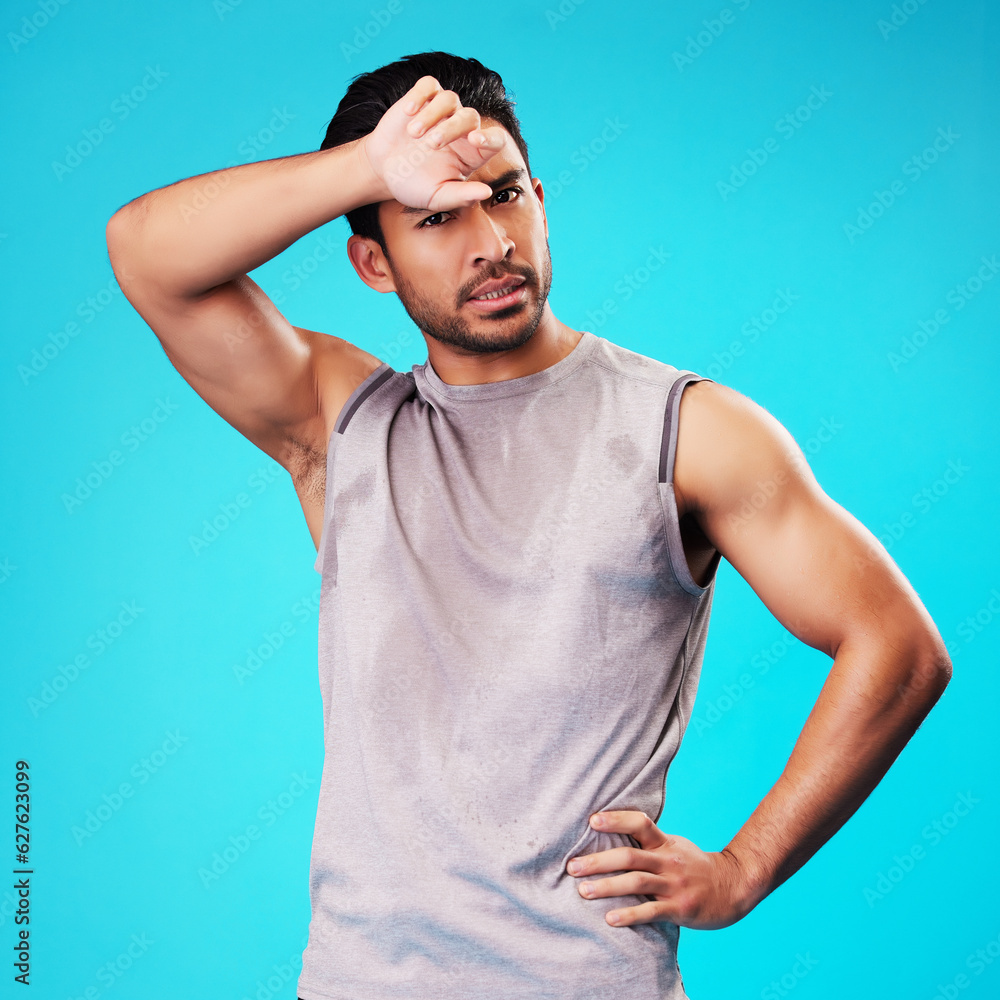 Portrait, fitness and Asian man tired after exercise in studio isolated on a blue background. Face, 