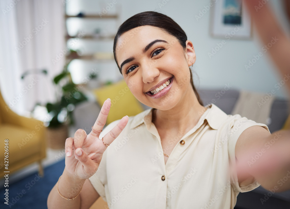 Happy woman, portrait and peace for selfie in home, video call or live streaming vlog in living room