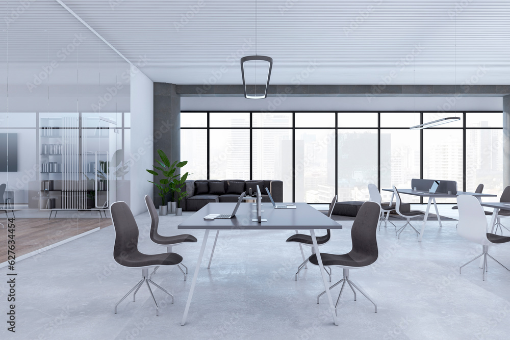 Clean open space designer office interior with furniture, panoramic windows with city view, concrete