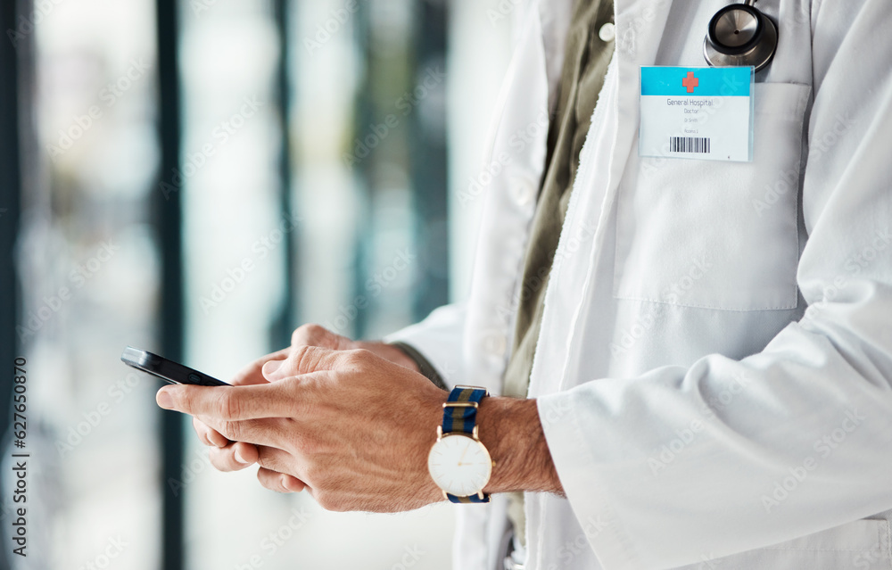 Phone, hands and man doctor typing message, social media or planning online schedule in a hospital. 