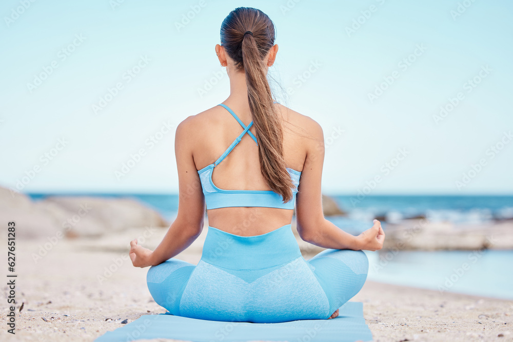 Yoga, meditation and back view of woman at the beach for workout or training as health, mindfulness 