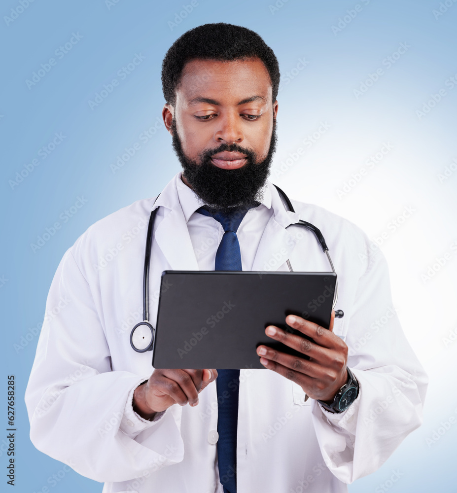 Healthcare, tablet and a black man doctor in studio on a blue background for cardiology research. Me