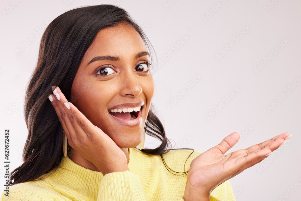 Excited, wow and portrait of a woman on a studio background with mockup for marketing. Happy, amazed