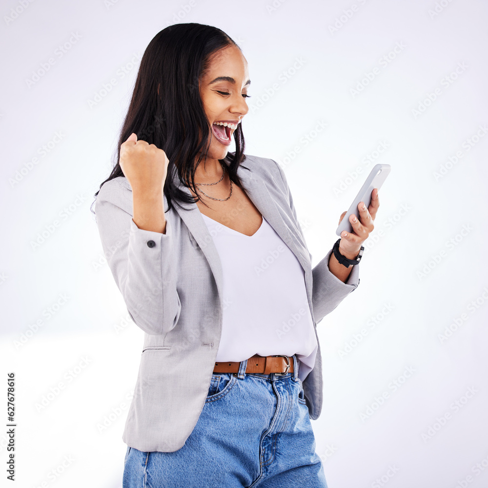 Fist, celebration and happy woman with phone in studio for news, deal or sign up success on white ba