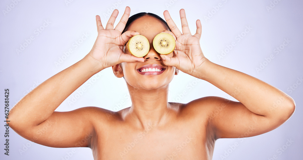 Woman, kiwi fruit and natural beauty, hands and skin with eco friendly skincare on purple background