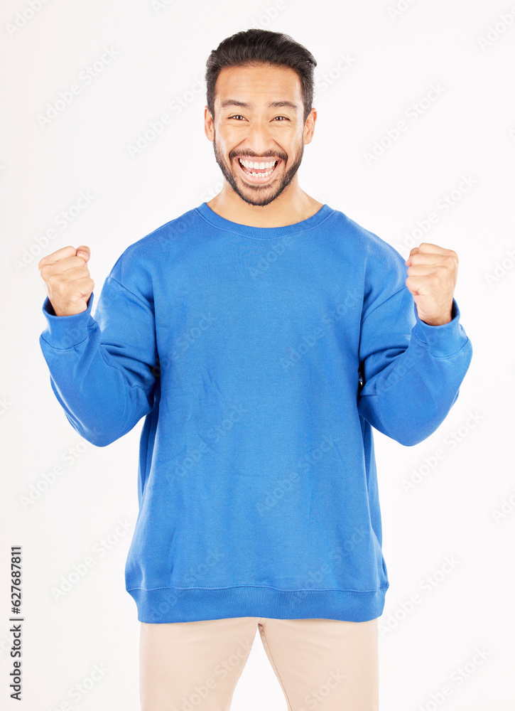 Winner, portrait and man with yes and excited gesture in a studio with a smile. Motivation, happy an