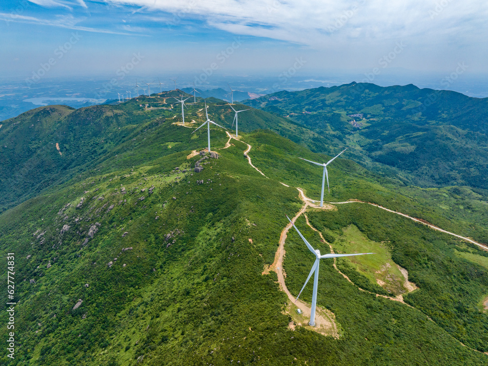 Wind farm on the mountain, blue sky and white clouds