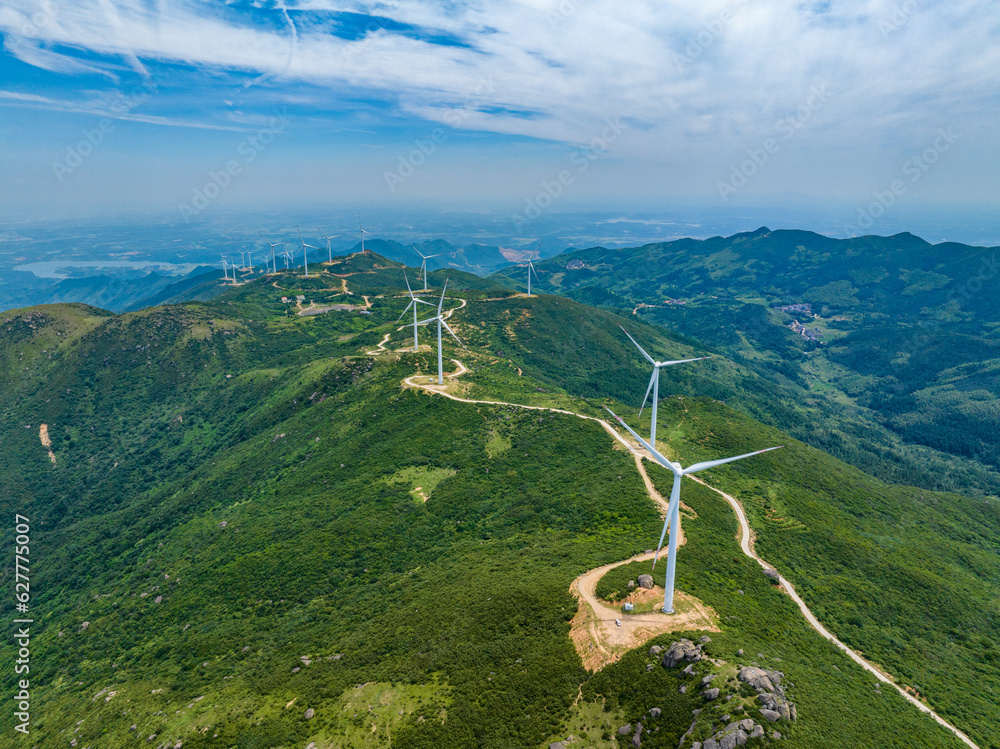 Wind farm on the mountain, blue sky and white clouds