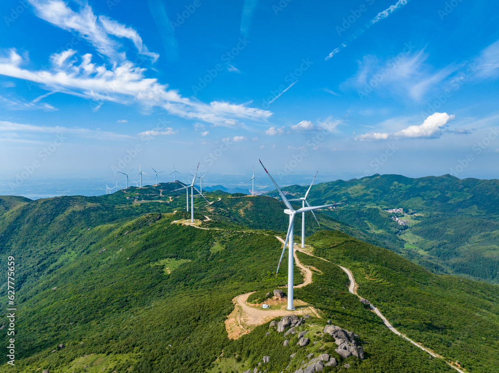 Wind farm on the mountain, blue sky and white clouds