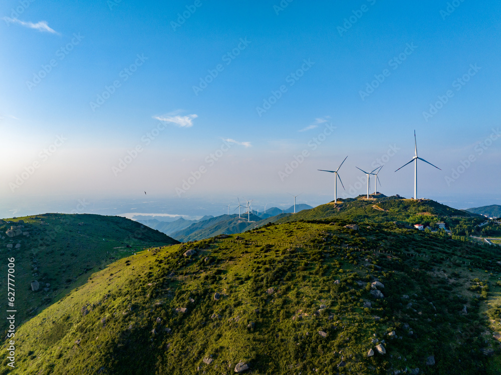 Wind farm on the mountain, blue sky and white clouds