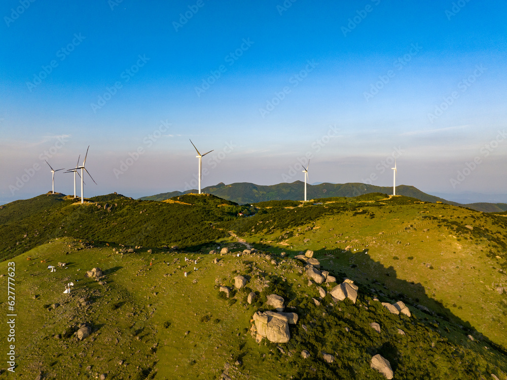 Wind farm on the mountain, blue sky and white clouds