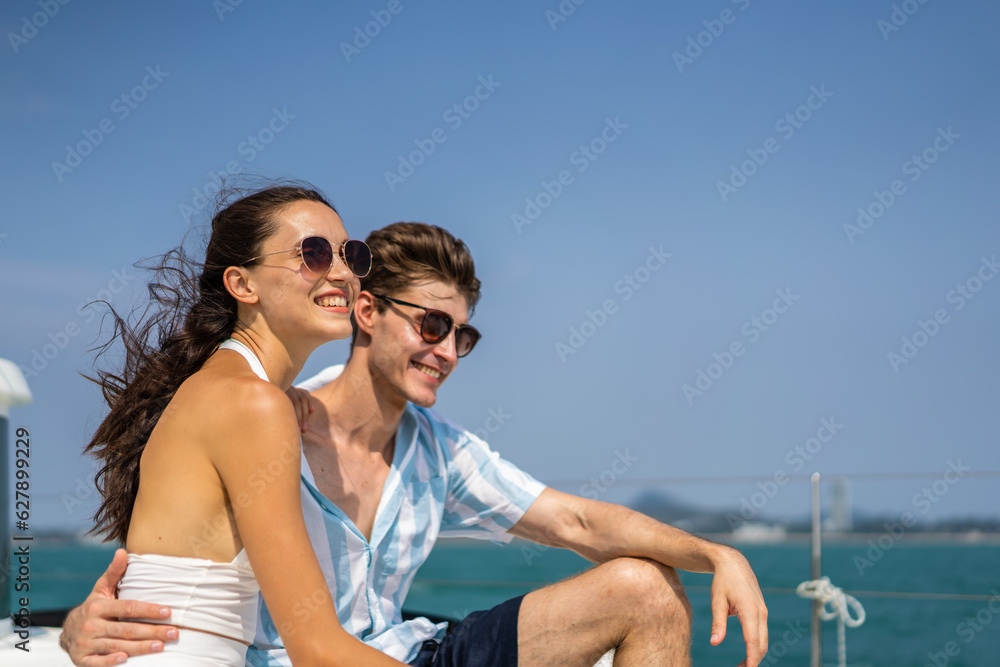 Caucasian romantic couple looking at beautiful view during yachting. 